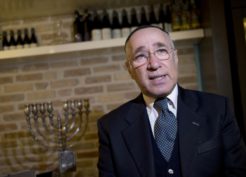 Rabbi Jaakov Spizzichino, a kosher inspector with Rome's chief rabbinate, speaks with the Associated Press at the Ba'Ghetto restaurant, in Rome, Monday Jan. 20, 2014. For just one day, the kitchen of the Vatican hotel where Pope Francis lives went kosher, with Rabbi Jaakov Spizzichino overseeing the scrupulous cleaning of countertops, boiling of utensils and heating of the oven necessary to render it fit for cooking under Jewish dietary laws. The occasion? A four-course luncheon Francis hosted last week for a dozen Argentine rabbis. Francis was hosting Rabbi Abraham Skorka and about 15 other rabbis from Buenos Aires who came to Rome en masse to visit their old friend, and the Vatican pulled out all the stops. Organizers turned to Ba'Ghetto, one of the best kosher restaurants in Rome's ghetto on the other side of the Tiber River, to cater the affair. (AP Photo/Alessandra Tarantino)