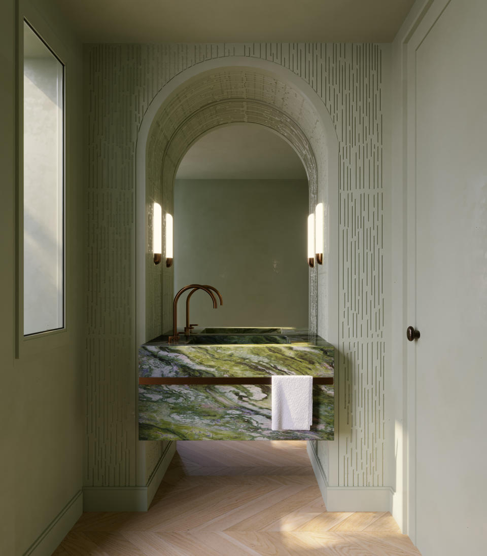 green bathroom with arched wall and green marbled sink