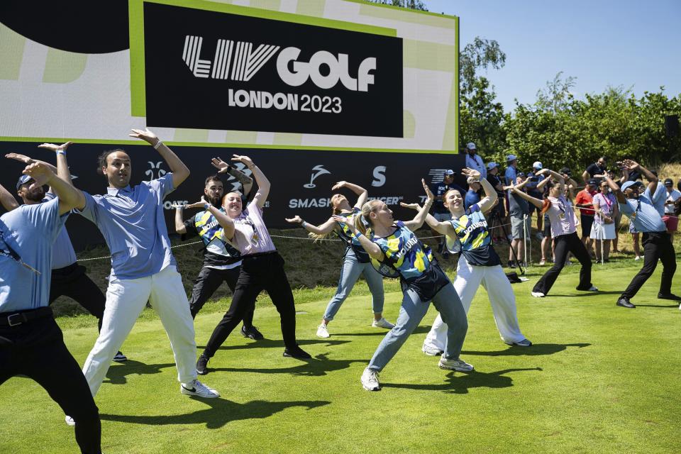 A flash mob on the first tee during the first round of LIV Golf London