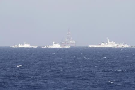 An oil rig (C) which China calls Haiyang Shiyou 981, and Vietnam refers to as Hai Duong 981, is seen in the South China Sea, off the shore of Vietnam in this May 14, 2014 file photo. REUTERS/Minh Nguyen/Files