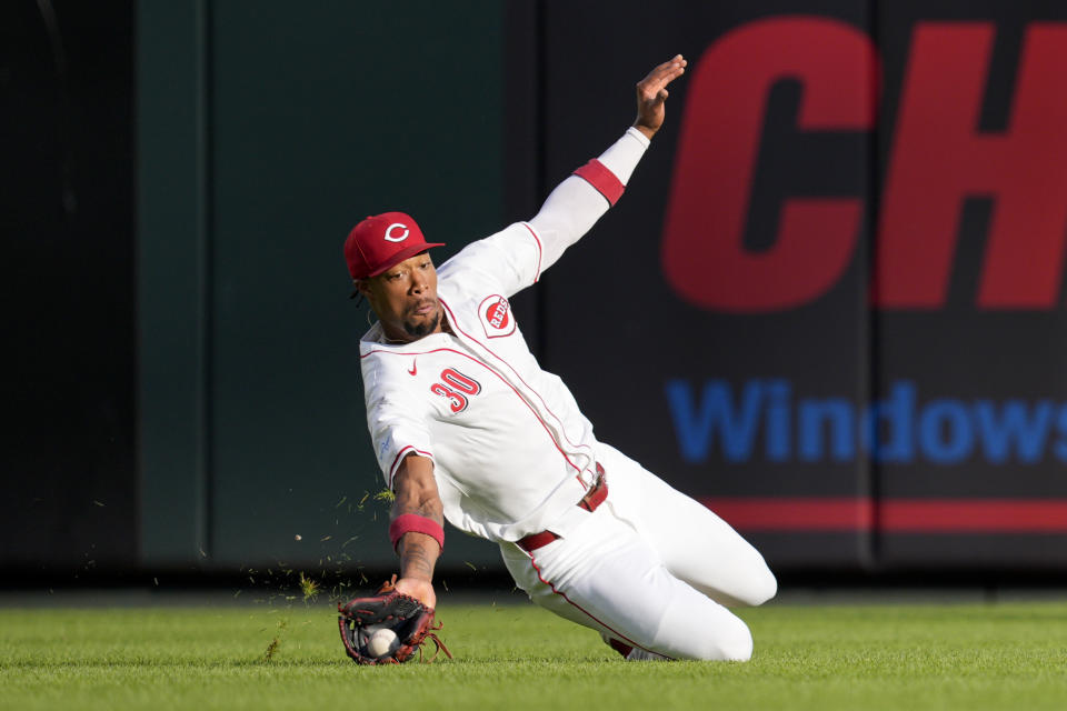 Cincinnati Reds outfielder Will Benson catches a line drive hit by Colorado Rockies' Charlie Blackmon during the first inning of a baseball game, Monday, July 8, 2024, in Cincinnati. (AP Photo/Jeff Dean)