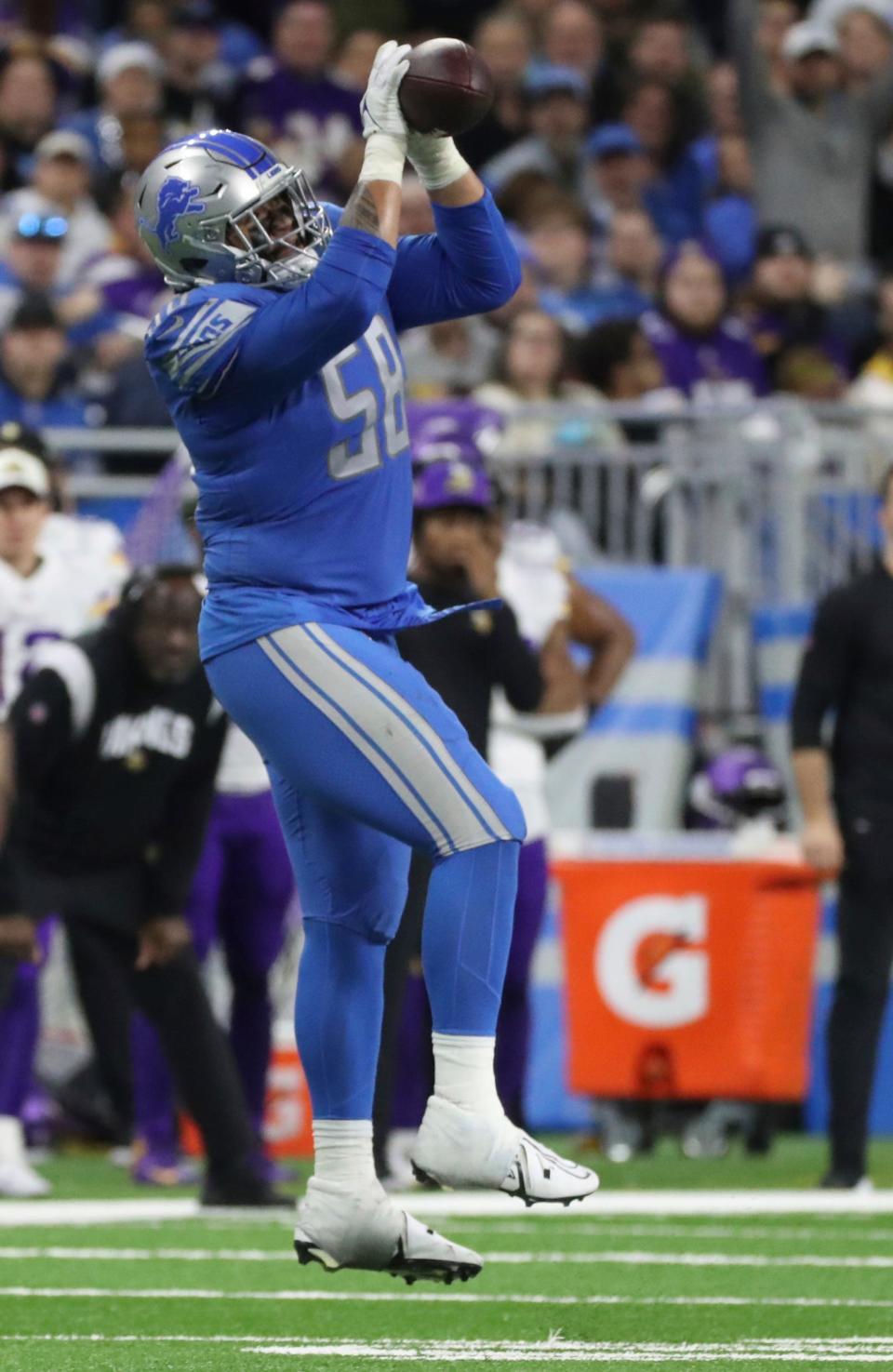 Lions offensive tackle Penei Sewell catches a first-down pass during the fourth quarter of the Lions' 34-23 win over the Vikings on Sunday, Dec. 11, 2022, at Ford Field.