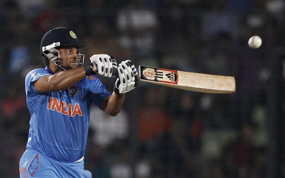 India's Suresh Raina plays a shot during their ICC Twenty20 Cricket World Cup semifinal match against South Africa in Dhaka, Bangladesh, Friday, April 4, 2014.(AP Photo/A.M. Ahad)