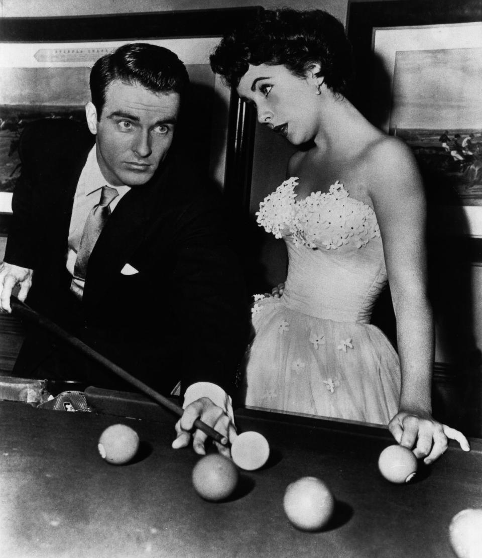 <p>Elizabeth Taylor was known for her glamorous style, and the characters she played on-screen were no exception. For her climatic scene in <em>A Place in the Sun </em>with Montgomery Clift, the starlet stole the show in a strapless tulle ball gown with floral appliqué. </p>