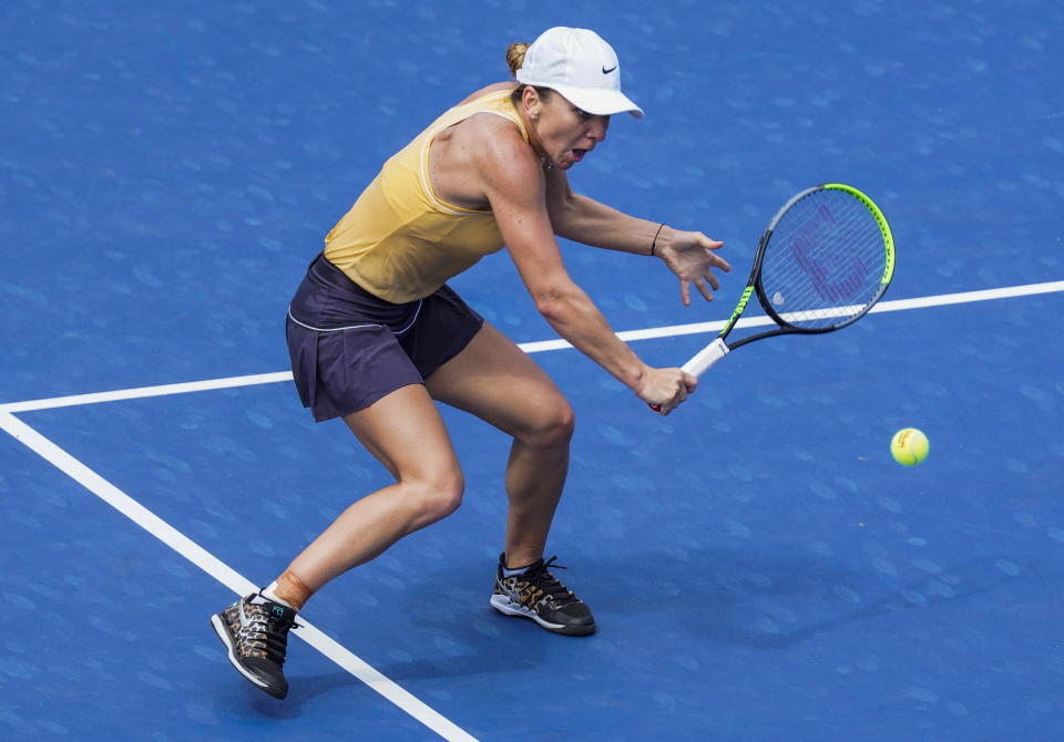 Simona Halep is a Romania returns a shot to Jennifer Brady of the US during round 2 of the Rogers Cup Women's tennis tournament in Toronto, Wednesday, Aug. 7, 2019. (Mark Blinch/The Canadian Press via AP)