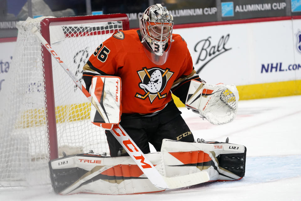 Anaheim Ducks goaltender John Gibson looks to stop a shot by the Colorado Avalanche in the first period of an NHL hockey game Friday, March 5, 2021, in Denver. (AP Photo/David Zalubowski)