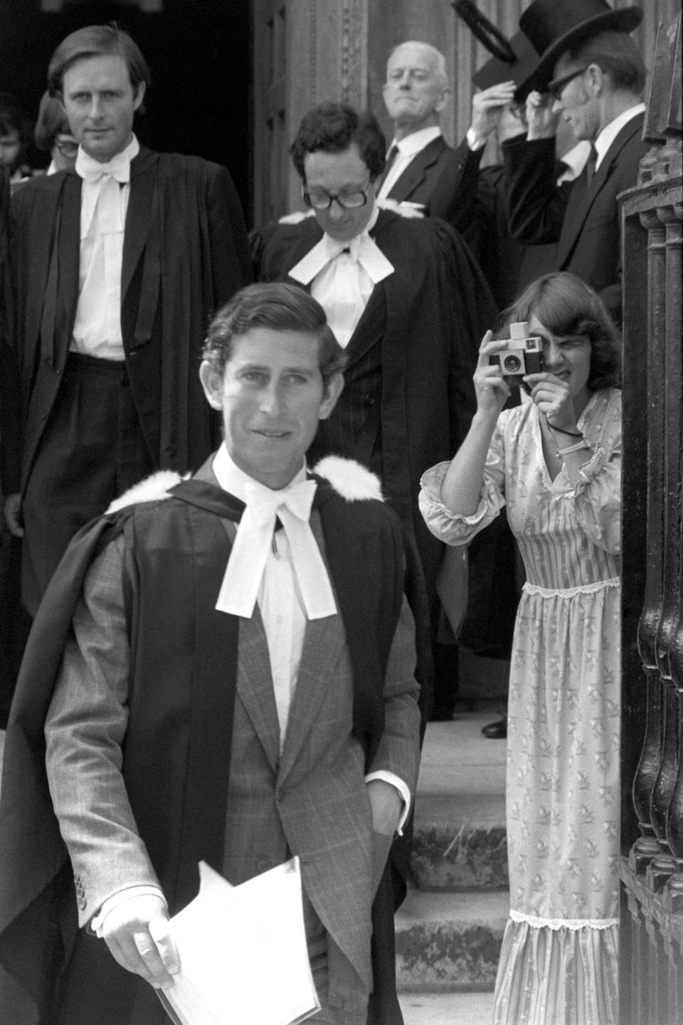 Prince Charles outside Senate House, Cambridge, after being awarded a Master of Arts degree from the university in 1975. He had previously graduated in 1970 with a 2:2 after three years of university. (PA Images)