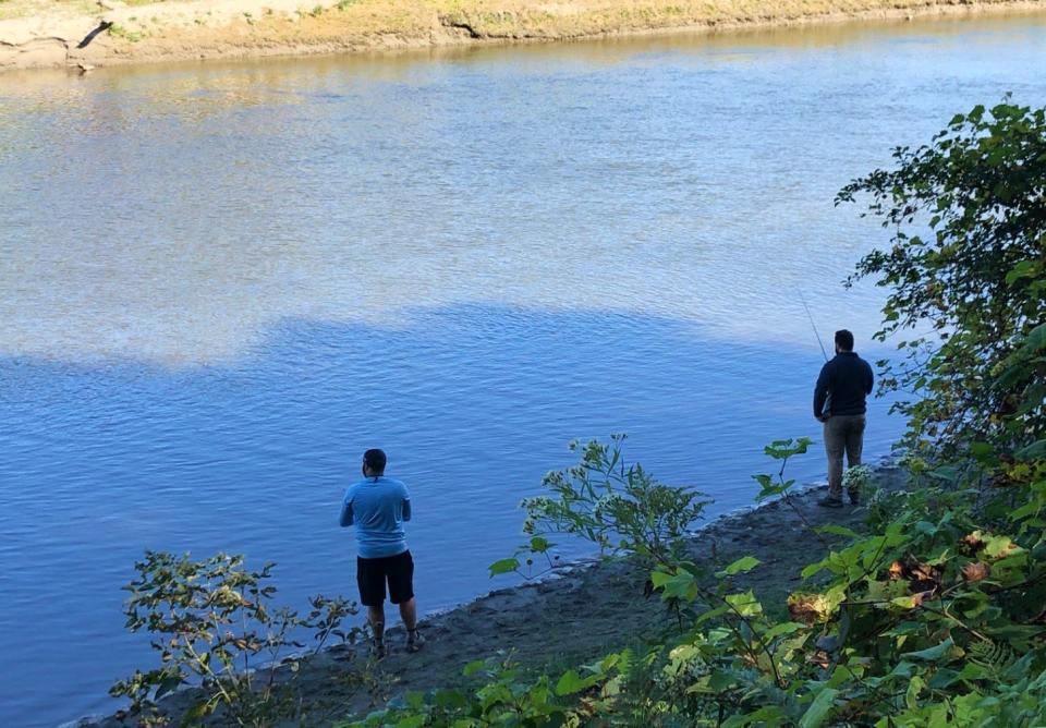 Two anglers cast from the bank of the Winooski near The Salmon Hole in Burlington on Sunday, Sept. 29, 2019.