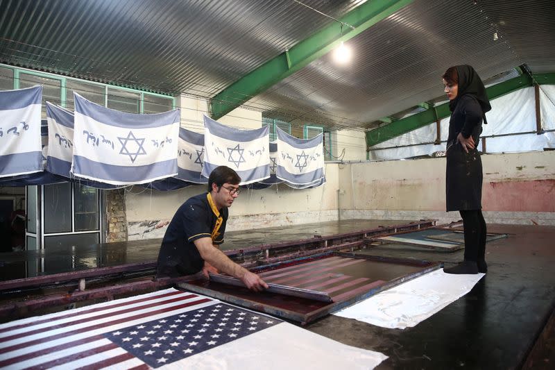 Large flag factory creates U.S. and Israeli flags for Iranian protesters to burn in Khomein City