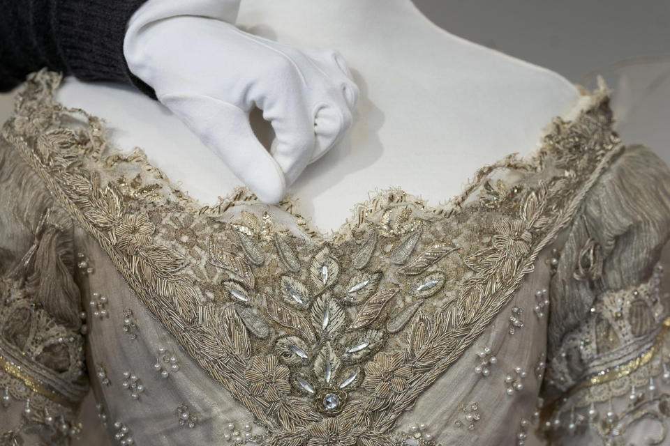 Detail on the bodice of Drew Barrymore's costume as Danielle in the film Ever After A Cinderella Story, 1998 as it is displayed at Kerry Taylor Auctions in London, Tuesday, Feb. 27, 2024. The costume estimated at 1,000-1,500 UK Pounds (1,300-1,900 US Dollars) is one of 69 that will be for auction in the Lights Camera Auction event on March 5. The costumes have been donated by Cosprop in support of The Bright Foundation, an arts education charity, established and funded by John Bright, to provide life-enhancing, creative experiences for children and young people facing disadvantage. (AP Photo/Kirsty Wigglesworth)
