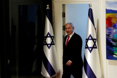 Israeli Prime Minister Benjamin Netanyahu arrives to a nomination ceremony at the President's residency