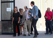 Sea-Watch3 German captain Carola Rackete, left, leaves after being questioned in court in the southern Sicilian town of Agrigento, Italy, Thursday, July 18, 2019. Rackete, who forced a government block docking at an Italian port after rescuing migrants, faces questioning by Italian prosecutors over allegedly aiding illegal immigration. (Pasquale Claudio Montana Lampo/ANSA via AP)