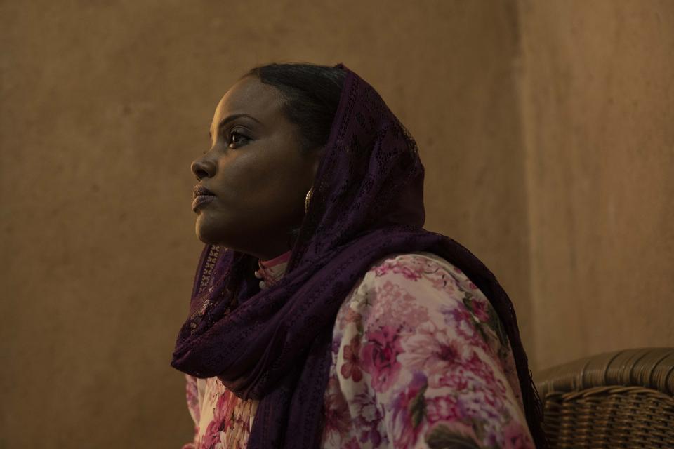 In this Jan. 11, 2020 photo, Sudanese psychologist Sulima Ishaq Sharif listens during an interview, in Khartoum, Sudan. Over the past year, activists have been steadily documenting rape victims from the June 3, 2019 crackdown on a protest camp. They believe it was a coordinated campaign ordered by the military's top leadership to crush the spirit of the pro-democracy movement. Sharif, who at the time headed a trauma center at Khartoum's Ahfad University said her center documented at least 64 rape victims. The number is likely considerably higher, since many victims don't speak because of fear or the stigma connected to rape. They said hundreds more women were sexually assaulted. (AP Photo/Nariman El-Mofty)