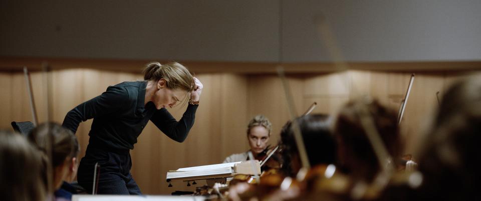 Lydia (Blanchett) leads her orchestra while her wife, Sharon (Nina Hoss) looks on in Tar. (Photo: ©Focus Features/Courtesy Everett Collection)