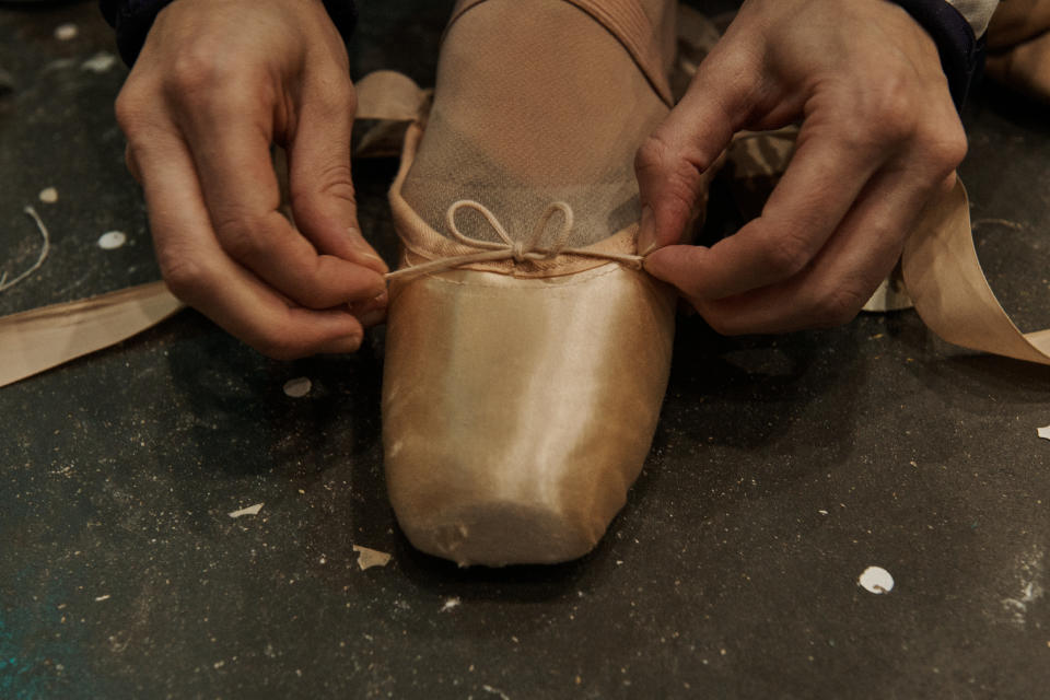 Unity Phelan puts on her pointe shoes.