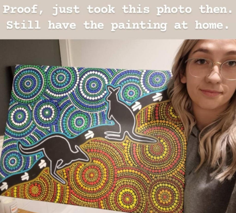 Seen here, artist Elle Campbell next to the painting at the centre of the Indigenous design drama.