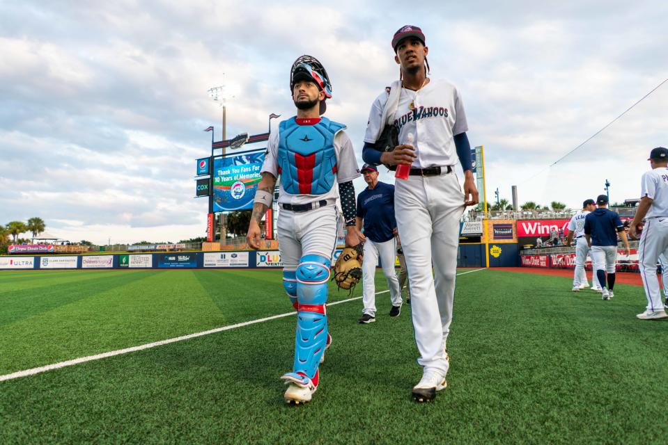 Blue Wahoos catcher Will Banfield and star pitcher Eury Perez leave a warmup session during 2022 season. Banfield will be part of team's Fish Fest event on January 19.