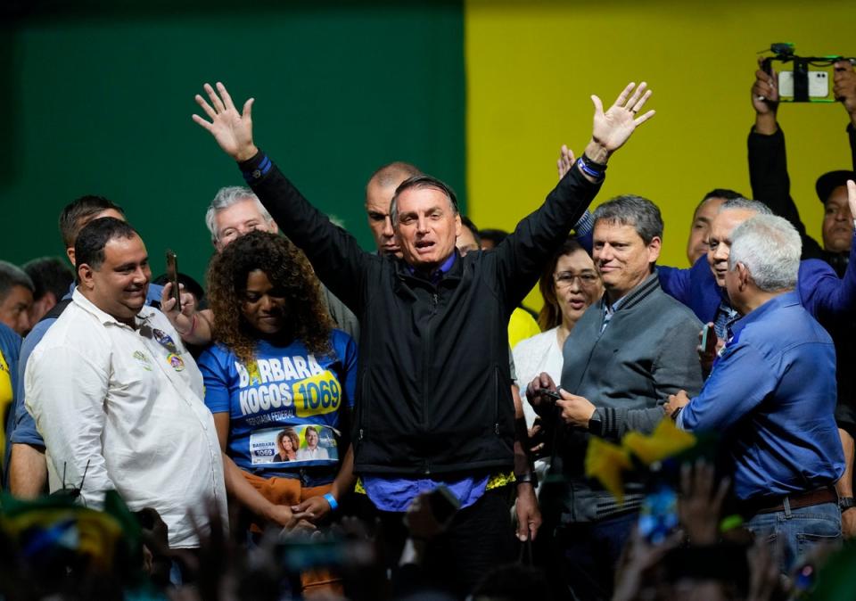 Brazilian President Jair Bolsonaro, who is running for a second term, waves to supporters during a campaign rally in Santos, Brazil, in September 2022 (Copyright 2022 The Associated Press. All rights reserved)