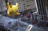 A Pikachu float makes its way down 6th Ave. during the 87th Macy's Thanksgiving day parade in New York November 28, 2013. REUTERS/Carlo Allegri (UNITED STATES - Tags: ENTERTAINMENT BUSINESS SOCIETY)
