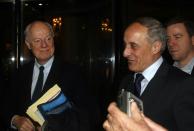 UN envoy for Syria, Staffan de Mistura (L), arrives at his hotel with Syrian assistant foreign minister, Ayman Sosan (R) in the Syrian capital Damascus on February 15, 2016