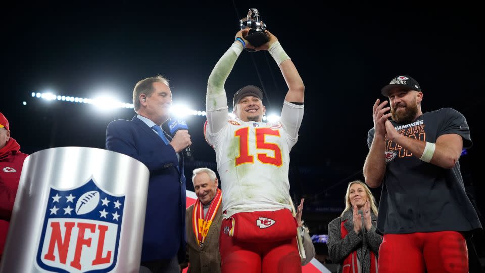 Kansas City Chiefs quarterback Patrick Mahomes holds up the Lamar Hunt Trophy next to Kansas City Chiefs tight end Travis Kelce after the AFC championship game against the Baltimore Ravens. - Matt Slocum/AP