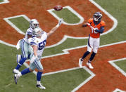 <p>Denver Broncos wide receiver Emmanuel Sanders (10) pulls in a touchdown catch as Dallas Cowboys middle linebacker Sean Lee (50) and cornerback Chidobe Awuzie (33) defend during the first half of an NFL football game, Sunday, Sept. 17, 2017, in Denver. (AP Photo/Joe Mahoney) </p>