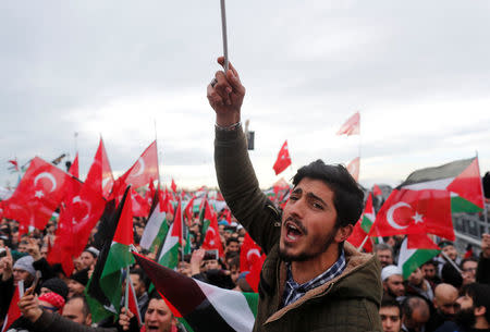 Demonstrators wave Turkish and Palestinian flags during a protest against U.S. President Donald Trump's recognition of Jerusalem as Israel's capital, in Istanbul, Turkey December 10, 2017. REUTERS/Osman Orsal