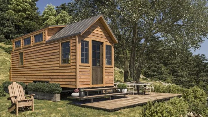 Photo of the Tiny Living home which has a wooden panel exterior