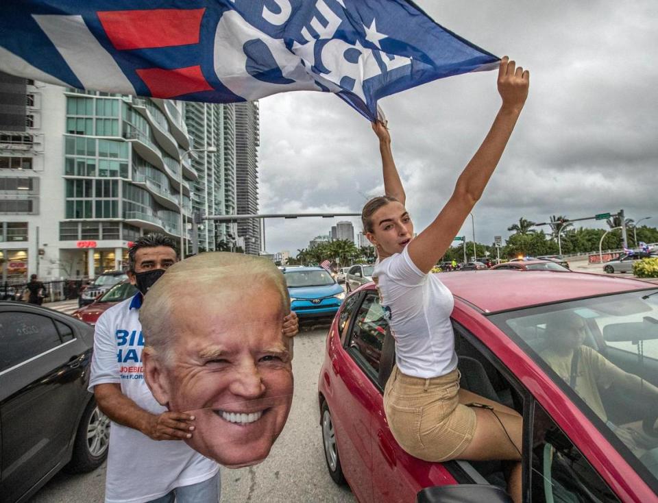 Celebrations break out along Biscayne Blvd in downtown Miami after Joe Biden wins the presidency over President Trump on Saturday, November 7, 2020.