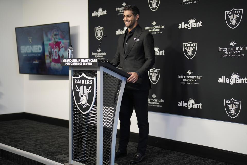 Las Vegas Raiders quarterback Jimmy Garoppolo takes questions at an NFL football news conference Friday, March 17, 2023, in Henderson, Nev. (AP Photo/John Locher)