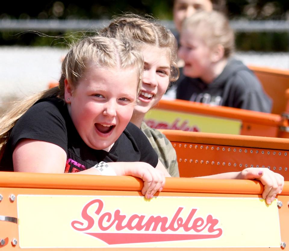 Stella Leone, left, and Cyleeana McCartney ride the Scrambler as Massillon City School fifth grade students visit Sluggers & Putters Amusement Park in Canal Fulton for an end of the year field trip.