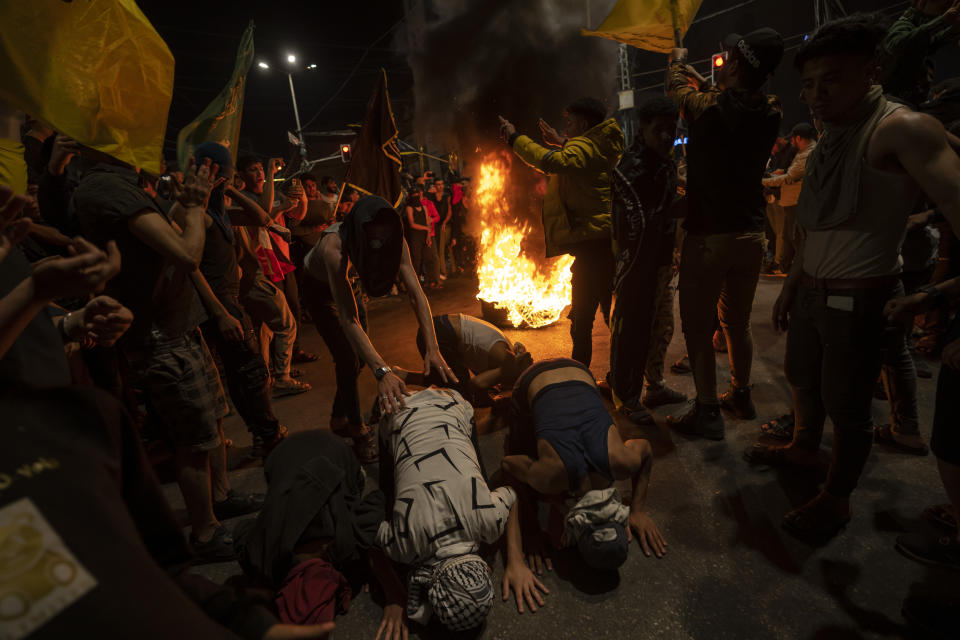 Palestinians celebrate the announcement of a cease-fire after five days of fighting between Israel and the Islamic Jihad militant group in Gaza City, Saturday, May 13, 2023. The two sides agreed to an Egyptian-brokered truce late Saturday, halting fighting that 33 Palestinians, including at least 13 civilians, dead. Two people in Israel were killed by rocket fire. (AP Photo/Fatima Shbair)