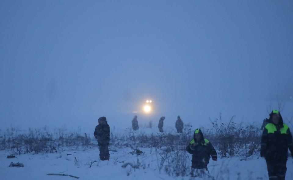 <p>Emergency services work at the scene where a short-haul regional Antonov AN-148 plane crashed after taking off from Moscow’s Domodedovo airport, outside Moscow, Russia on Feb. 11, 2018. (Photo: Maxim Shemetov/Reuters) </p>