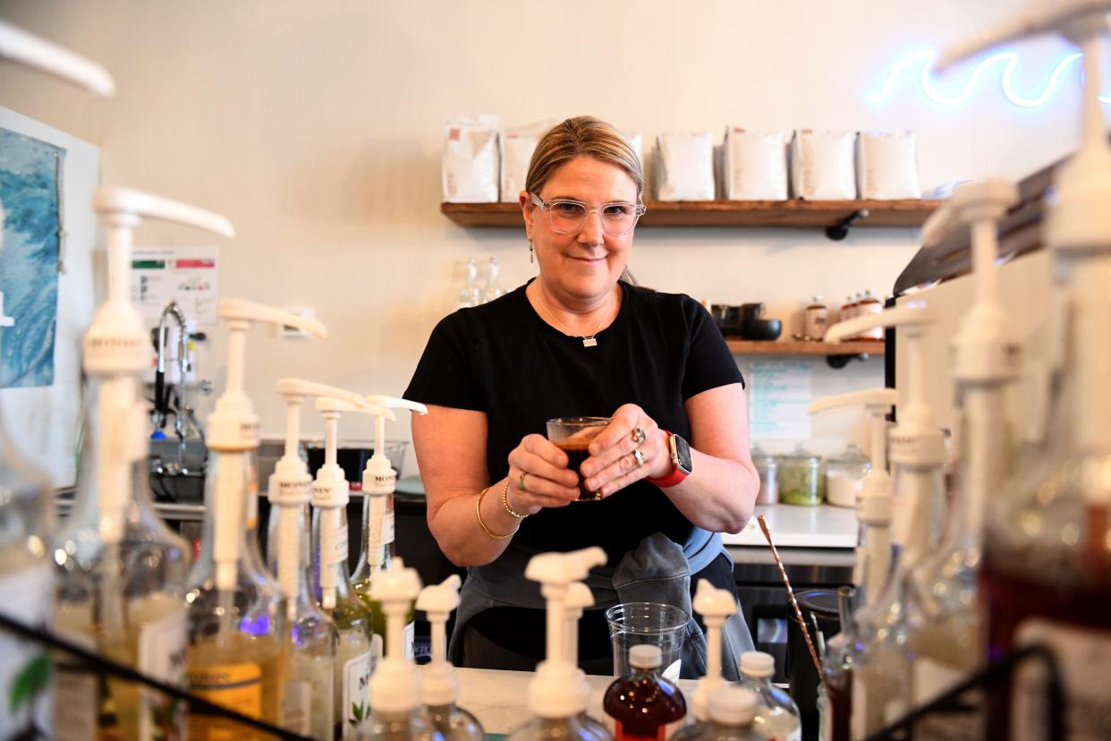 Claire Miller, owner of 2nd Wave Coffee and Social, makes an espresso for a latte Monday, March 4, 2024, at 19 Williams Street in Berlin, Maryland.