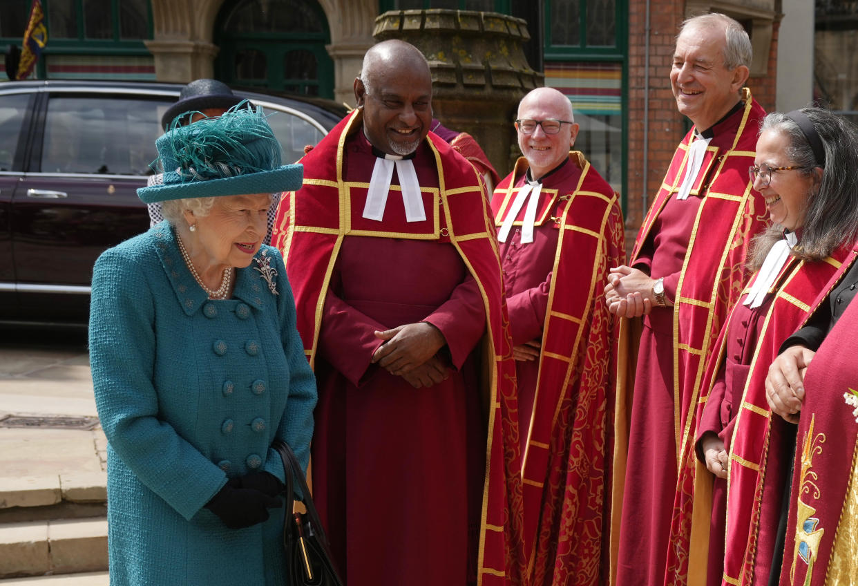 MANCHESTER, ENGLAND - JULY 08: (EDITORS NOTE: This image is a recrop of #1233866596) Queen Elizabeth II is introduced to members of the clergy by Dean of Manchester Cathedral, Rogers Govender as she visits Manchester Cathedral on July 8, 2021 in Manchester, England. (Photo by Christopher Furlong/Getty Images)