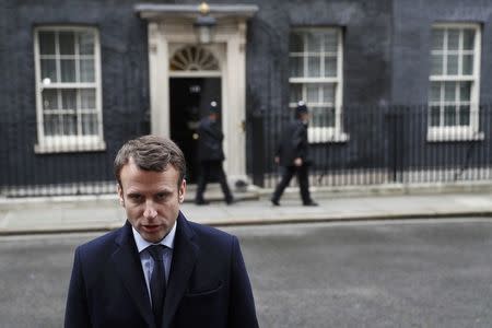 Emmanuel Macron, candidate in France's 2017 French presidential speaks to media outside 10 Downing Street in central London, Britain, February 21, 2017. REUTERS/Stefan Wermuth