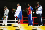 BEIJING - AUGUST 23: (L-R) Silver medalist Clemente Russo of Italy, gold medalist Rakhim Chakhkiev of Russia and bronze medalists Osmai Acosta Duarte of Cuba and Deontay Wilder of the United States stand on the podium during the medal ceremony for the Men's Heavy (91kg) Final Bout held at Workers' Indoor Arena on Day 15 of the Beijing 2008 Olympic Games on August 23, 2008 in Beijing, China. (Photo by Nick Laham/Getty Images)