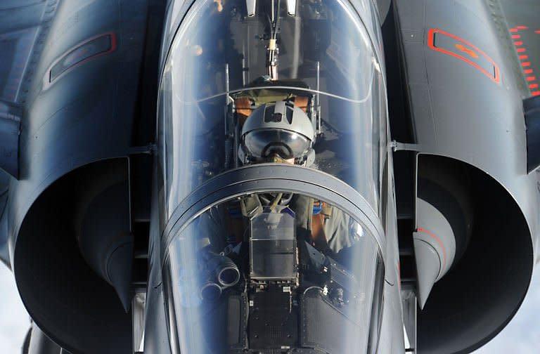 A French Mirage 2000 fighter jet from the Istres military air base approaches an airborne Boeing C-135 refuelling tanker aircraft during a refuelling operation above the Mediterranean sea as part of military actions over Libya. Libyan leader Moamer Kadhafi suffered a major blow with the defection of his foreign minister even as his forces again proved too strong for the rebels' rag-tag army