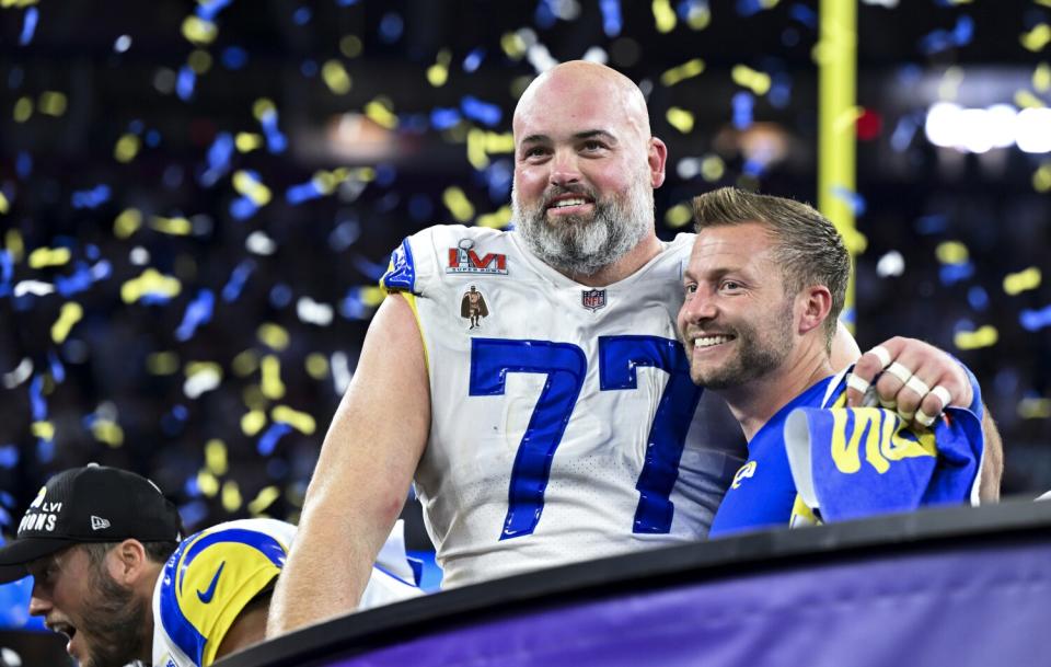Coach Sean McVay embraces offensive lineman Andrew Whitworth after the Rams won Super Bowl LVI.
