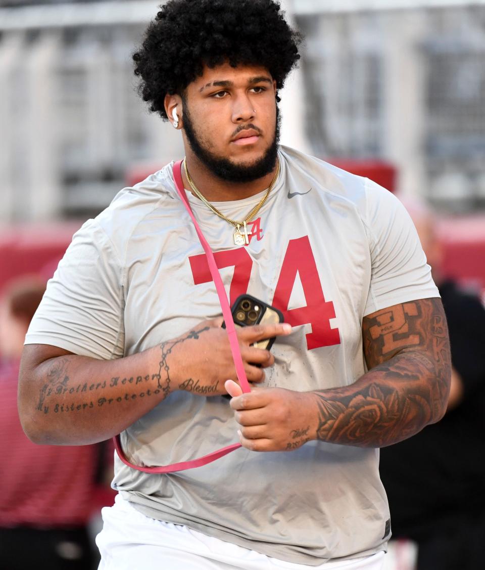 Nov 4, 2023; Tuscaloosa, Alabama, USA; Alabama Crimson Tide offensive lineman Kadyn Proctor (74) comes out to loosen up before the game with LSU at Bryant-Denny Stadium. Mandatory Credit: Gary Cosby Jr.-USA TODAY Sports