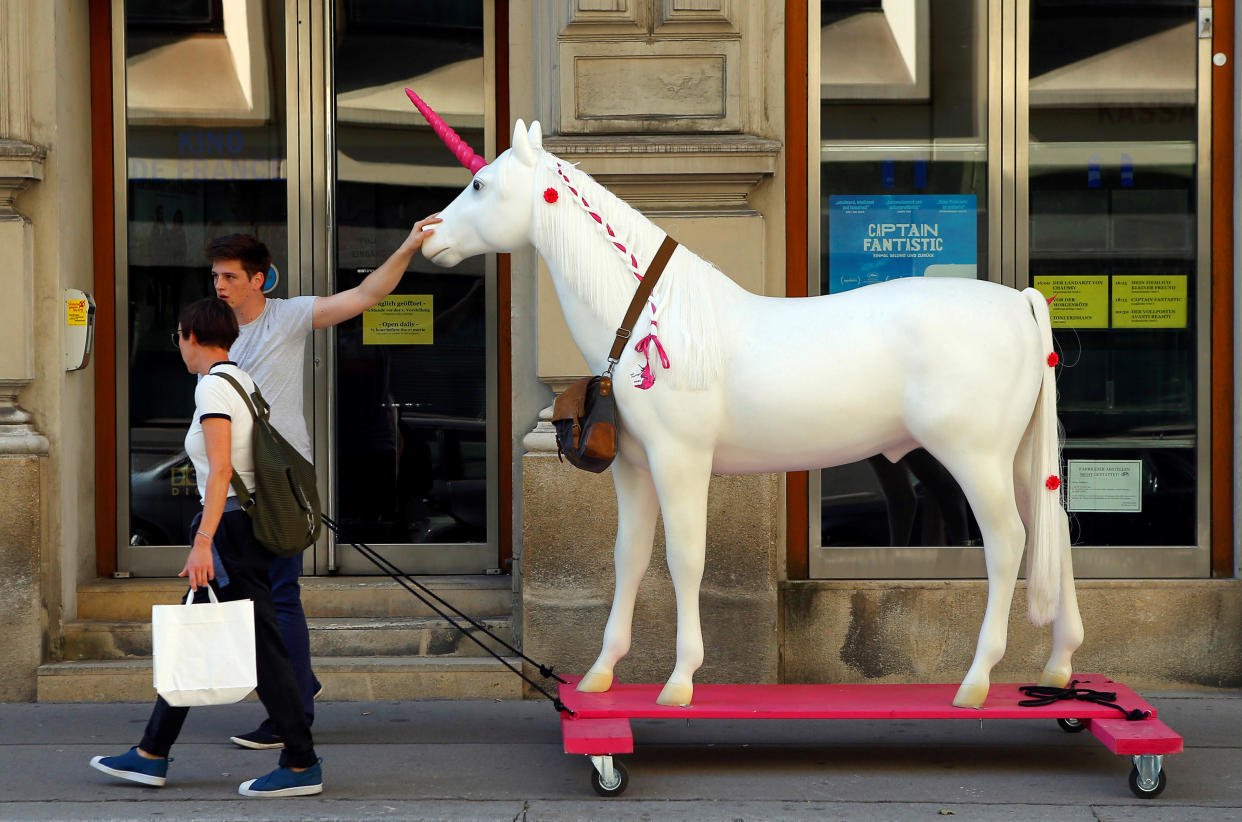 A unicorn mock-up, mascot of Vienna's Neos party, is being pulled along a street in Vienna, Austria September 30, 2016. REUTERS/Heinz-Peter Bader