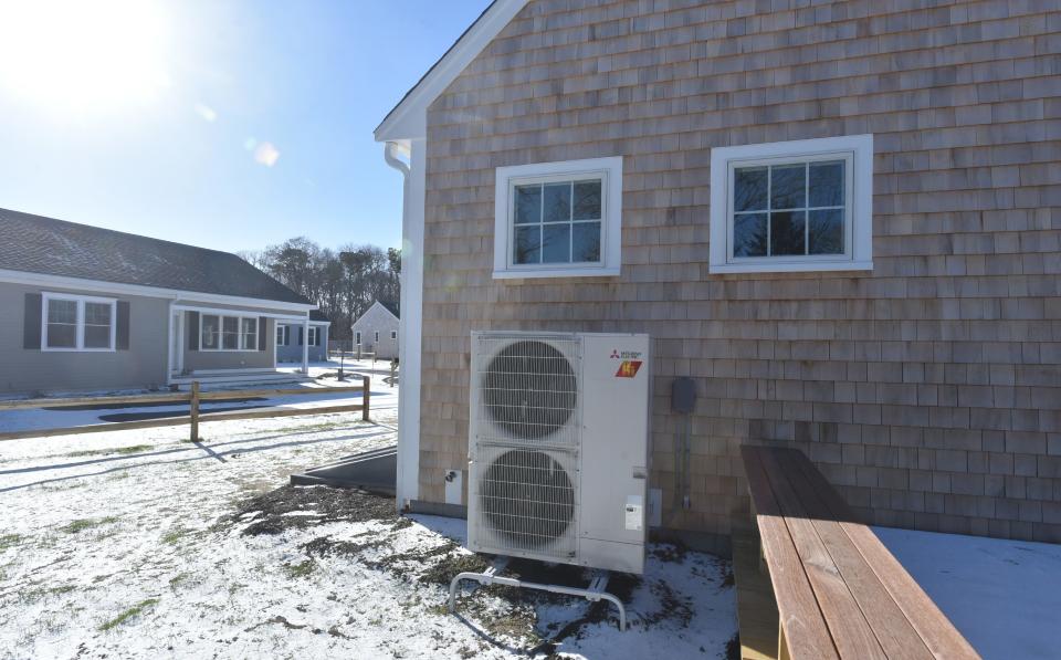 The use of heat pumps and solar panels reflect a focus on energy efficiency at the new Habitat for Humanity housing development in West Harwich, according to the housing nonprofit.