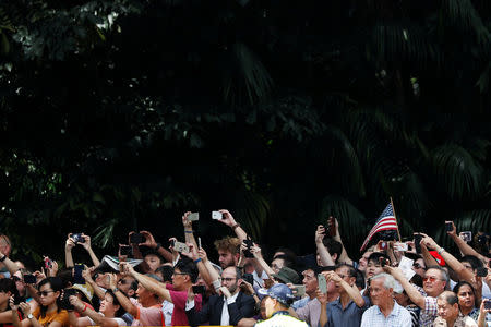 People gather outside the Istana in Singapore June 11, 2018. REUTERS/Edgar Su