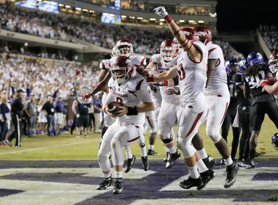 Arkansas quarterback Austin Allen (8) celebrates his touchdown run with teammates in double overtime against TCU in the 41-38 Arkansas win in an NCAA college football game, Saturday, Sept. 10, 2016, in Fort Worth, Texas. (AP Photo/Tony Gutierrez)