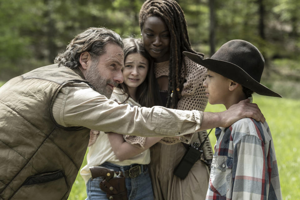 (L-R) Andrew Lincoln as Rick Grimes, Danai Gurira as Michonne, Cailey Fleming as Judith and Antony Azor as RJ