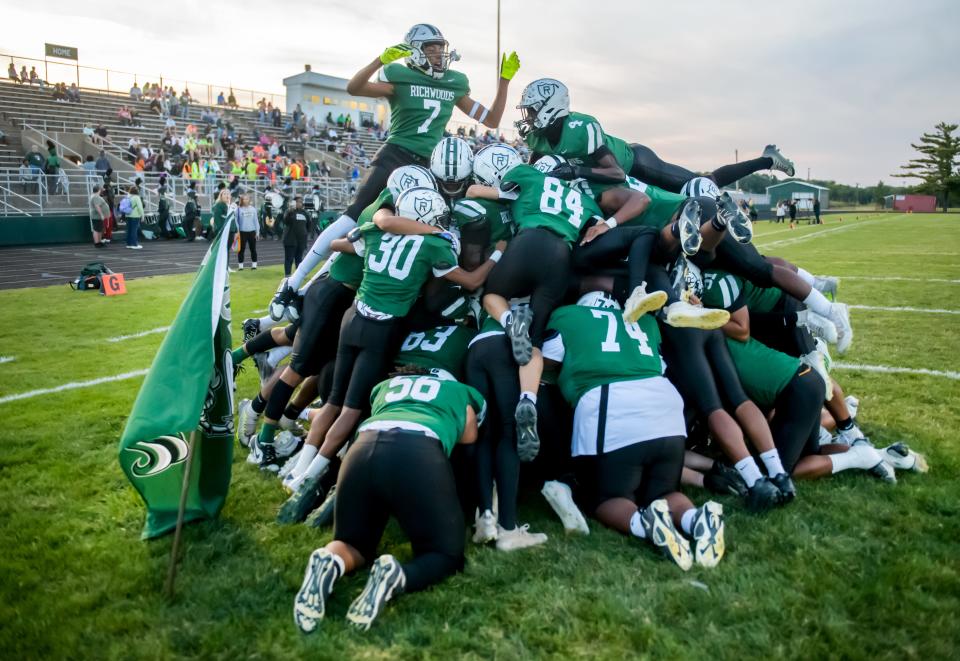 The Richwoods Knights perform their traditional dogpile before the start of their Week 4 football game Friday, Sept. 15, 2023 at Richwoods High School. The Peoria Notre Dame Irish routed the Knights 42-7.