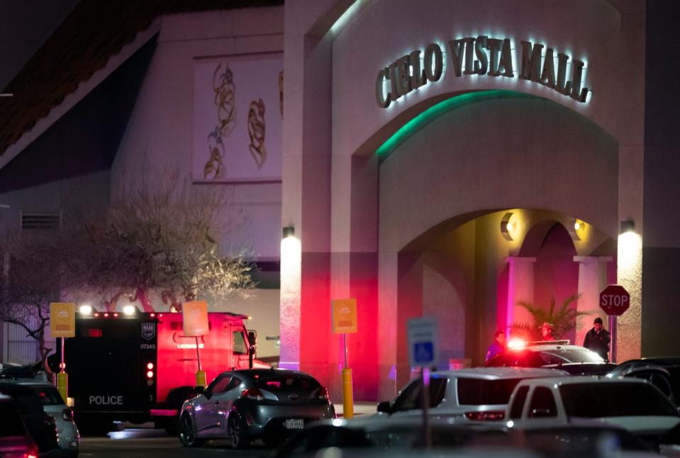 Law enforcement agents are seen at an entrance of the shopping mall (AP)