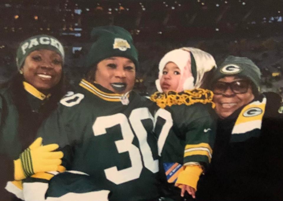 Jamaal Williams’ mother, Nicolle Thompson-Williams,  Jamaal’s daughter, Kalea, his grandmother Elaine Thompson-Carothers and great grandmother Alton Smith.