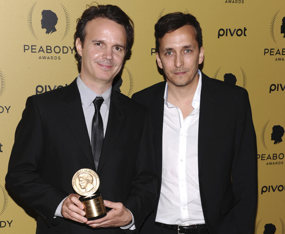 Craig Renaud, left, and Brent Renaud attend the Peabody Awards in New York in 2015. 