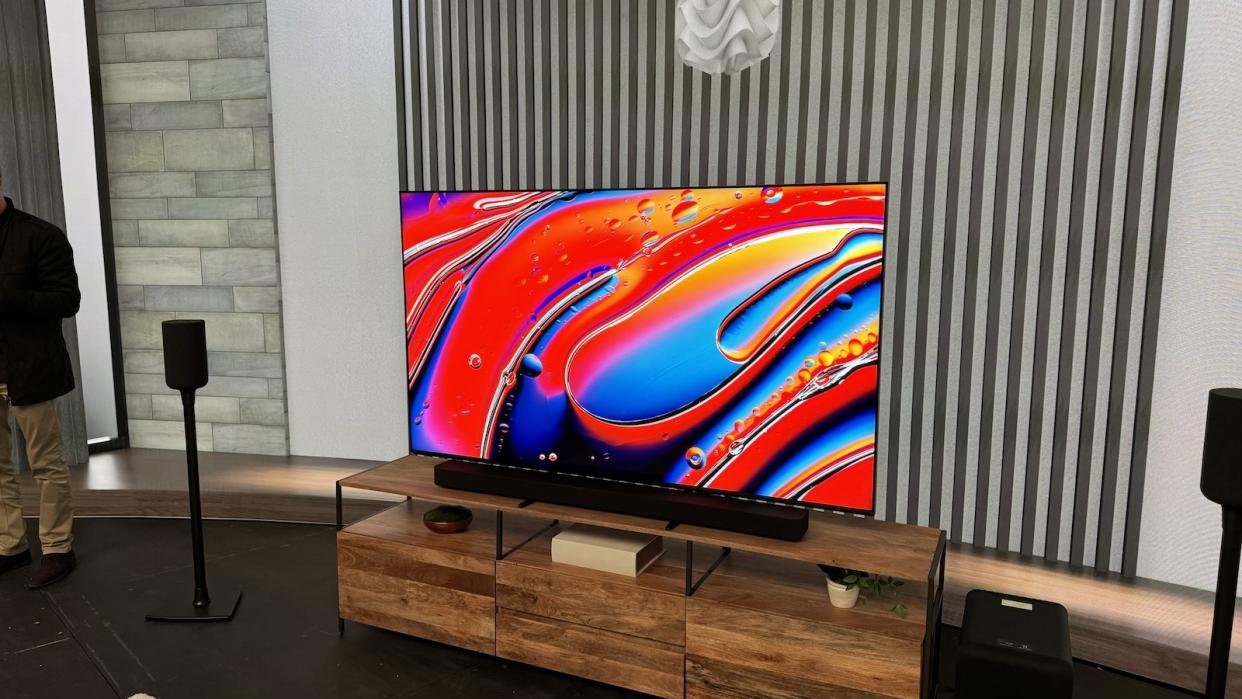  The Sony Bravia 9 photographed on a wooden stand in a lounge environment. 